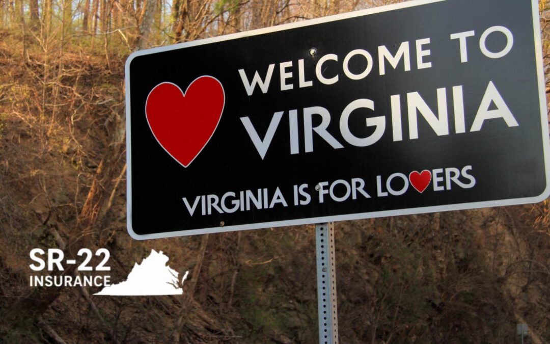 A roadside "Welcome to Virginia" sign with a black background and white text stands against a backdrop of bare trees and a rocky hillside. A large red heart is positioned to the left of the main text, and the state's slogan, "Virginia is for Lovers," is written in smaller white letters below, featuring a tiny red heart as the letter "O." In the bottom left corner, white text reads "SR-22 INSURANCE" next to a white silhouette map of the state of Virginia. - https://www.hanckelcitizens.com/